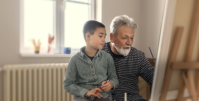 Man with metastatic pancreatic cancer painting at an easel with grandson. Safety and effectiveness of ONIVYDE have not been established in pediatric patients.