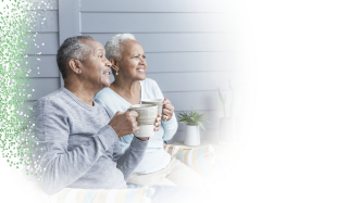 A couple affected by metastatic pancreatic cancer sitting on a porch having coffee