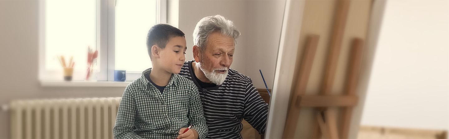 Man with metastatic pancreatic cancer painting at an easel with grandson. Safety and effectiveness of ONIVYDE have not been established in pediatric patients.